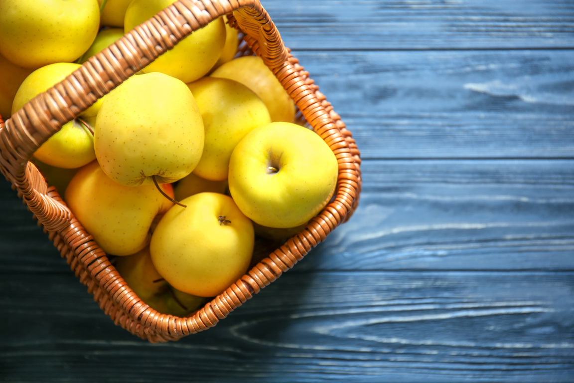 A Basket of Ripe Yellow Apples