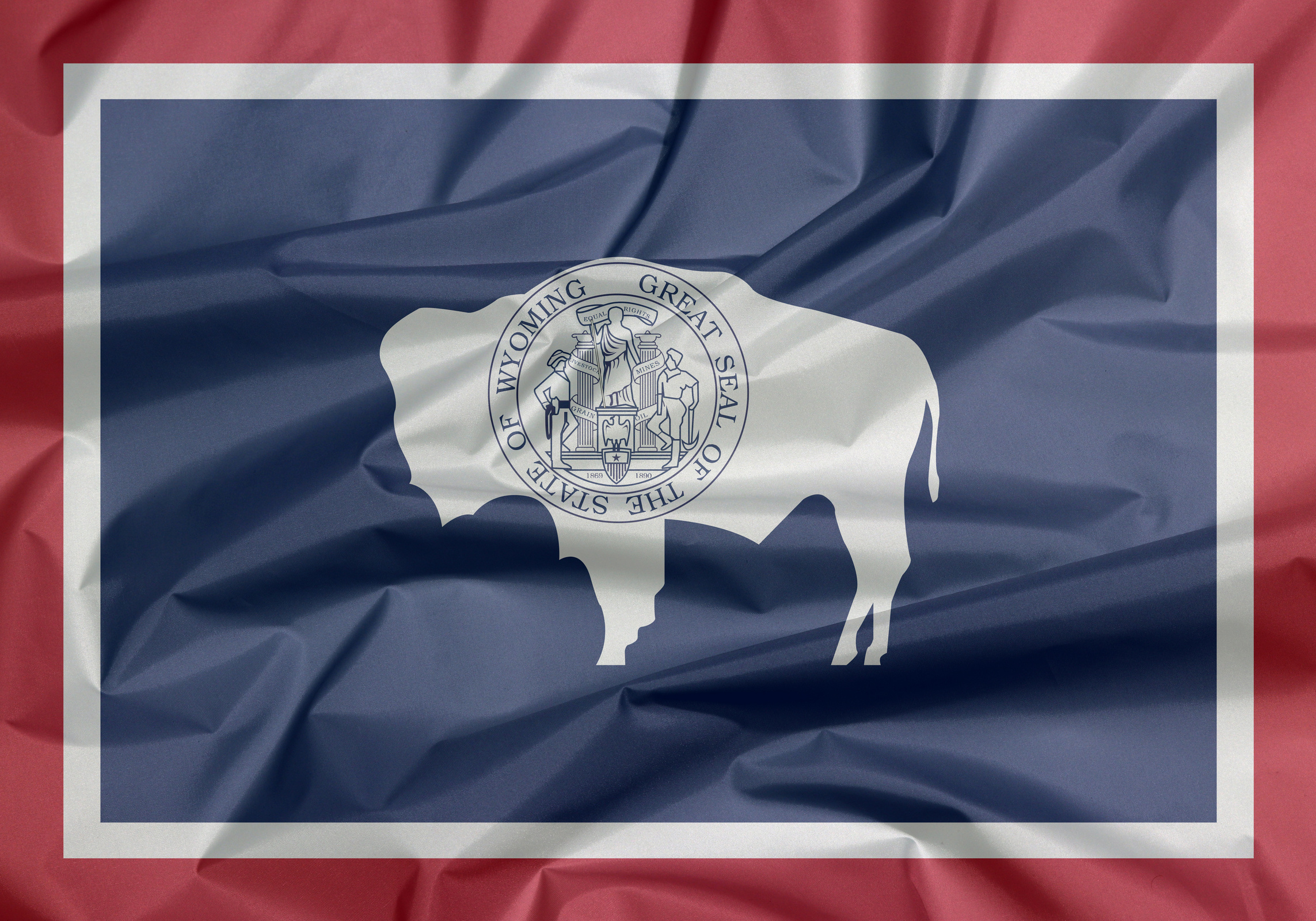 Fabric flag of Wyoming. Crease of Wyoming flag background, the states of America.